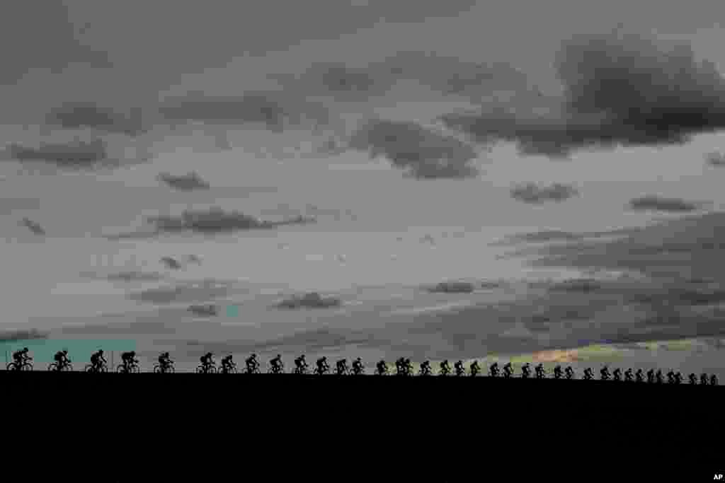 Riders pedal under a cloudy sky in the Men's Elite event in Imola, Italy, during the the UCI 2020 Road World Championships.