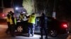 Police officers gather outside a grain depot in Przewodow, eastern Poland, where a blast that killed two people was reportedly caused by a stray Russian missile on Nov. 15, 2022. Russia has denied the allegation.