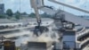 FILE - Grain is offloaded from a ship in the port of Mombasa, Kenya, on Nov. 26, 2022. Global prices for food commodities like grain and vegetable oils were the highest on record last year, exacerbating the high cost of living for low-income Kenyans.