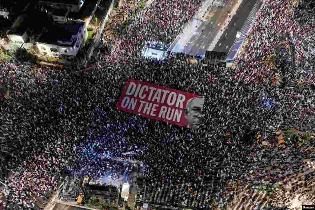 Israelis take part in a demonstration against Prime Minister Benjamin Netanyahu and his nationalist coalition government's judicial overhaul, in Tel Aviv, Sept. 23, 2023.