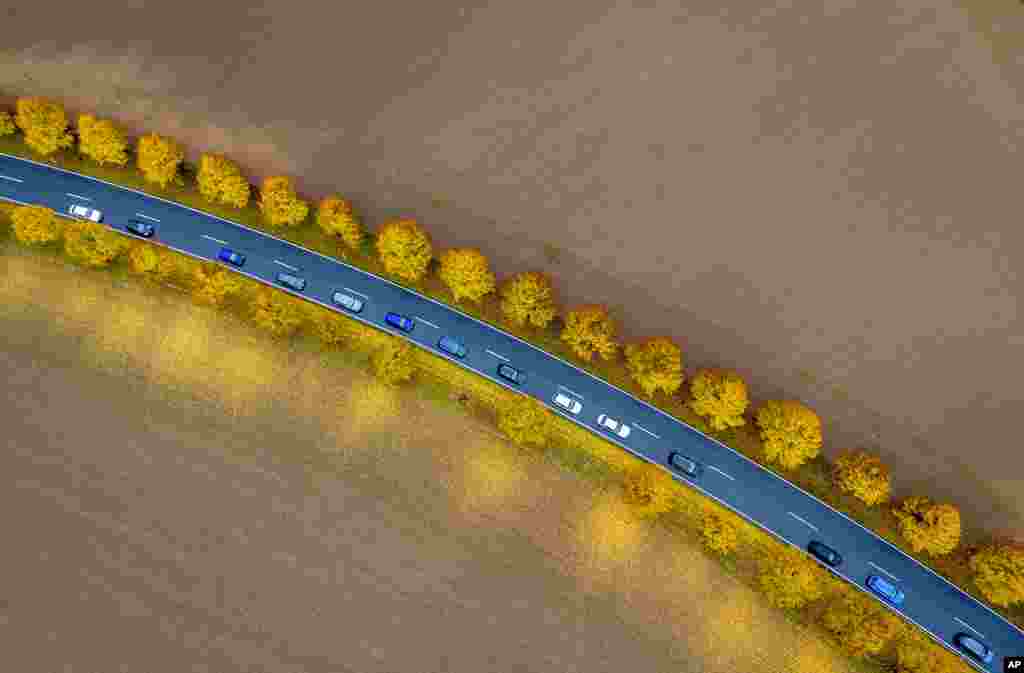 Cars drive on a road near Frankfurt, Germany.