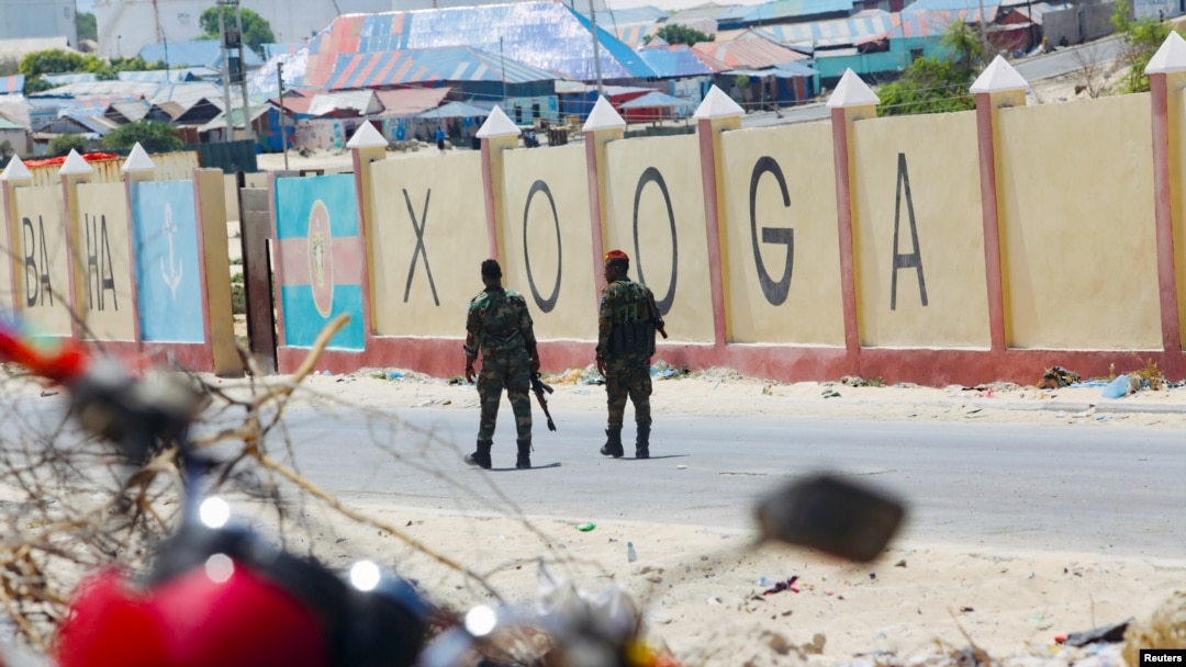 FILE - Somali military soldiers patrol outside the Aden Adde International Airport in Mogadishu, Somalia, April 27, 2022. The airport was named as a possible target after threats to multiple locations in the capital were received by the U.S. Embassy in Nairobi in April 2024. 
