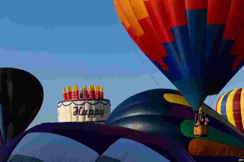 A hot air balloon lifts off during the 40th annual New Jersey Lottery Festival of Ballooning at Solberg Airport in Readington, New Jersey.