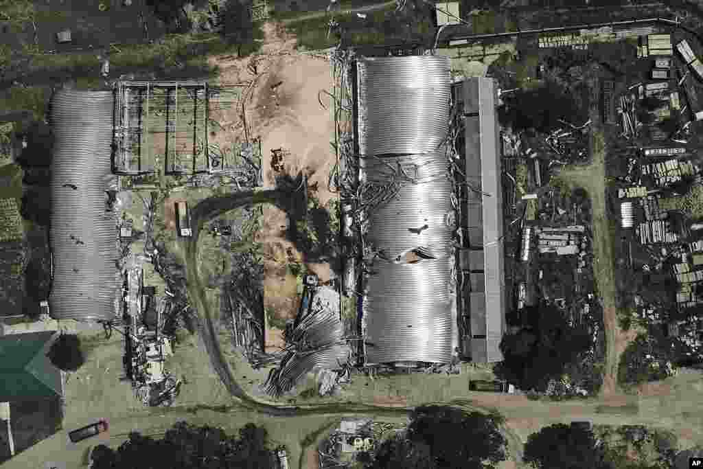 A farm storage building is seen heavily damaged after a Russian attack in Odesa region, Ukraine. A missile barrage injured two people, damaged equipment and destroyed 100 metric tons of peas and 20 metric tons of barley, regional Gov. Oleh Kiper said. 