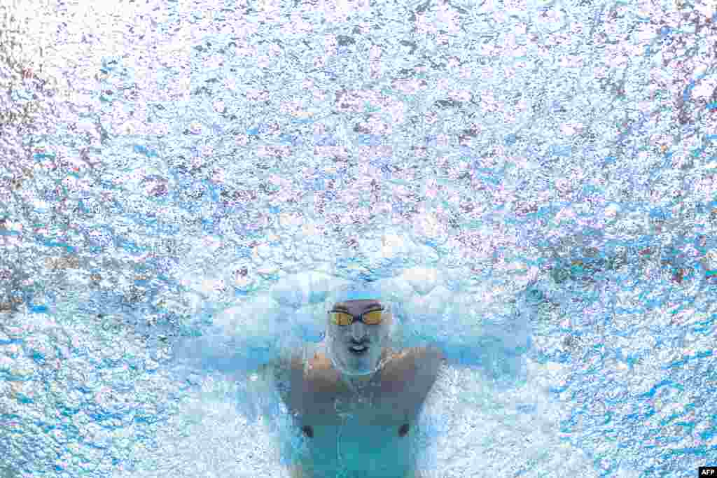 France's Maxime Grousset competes in a semi-final heat of the men's 50m butterfly swimming event during the World Aquatics Championships in Fukuoka, Japan.