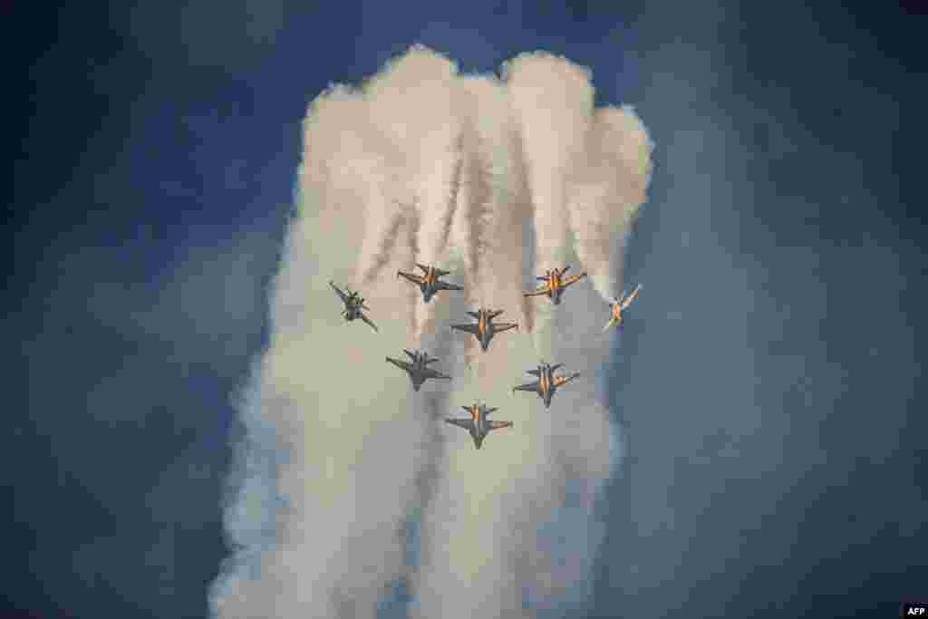 Members of South Korea's 'Black Eagle' aerobatics team perform a display at the Seoul International Aerospace and Defense Exhibition (ADEX) in Seongnam, south of Seoul.