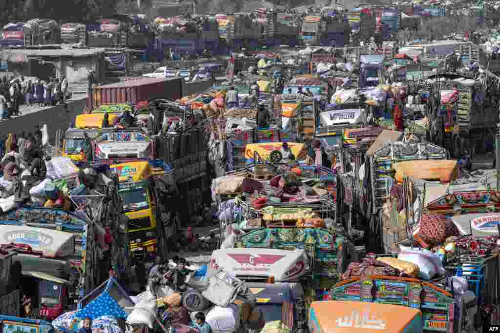 Afghan refugees arrive in trucks from Pakistan at the Afghanistan-Pakistan Torkham border in Nangarhar province. Islamabad has issued an order to 1.7 million Afghans it says are living in the country illegally to leave by November 1, or be deported. 