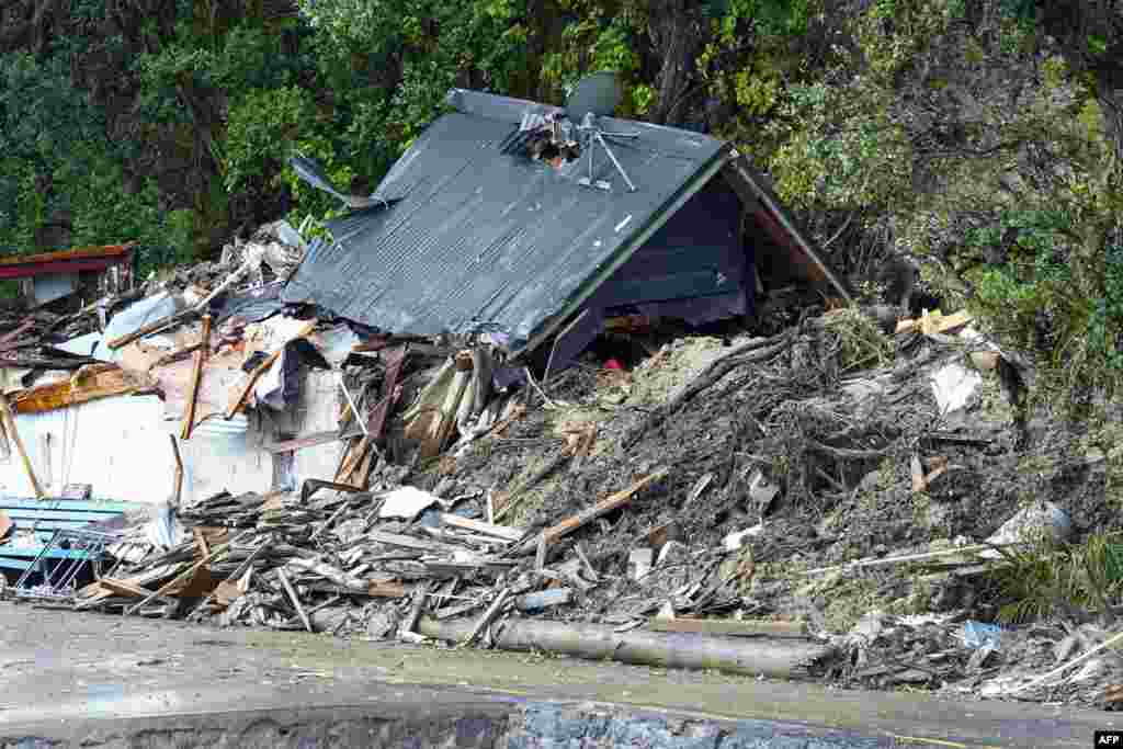 A general view of a damaged house after a storm battered Titirangi, a suburb of New Zealand's West Auckland area.