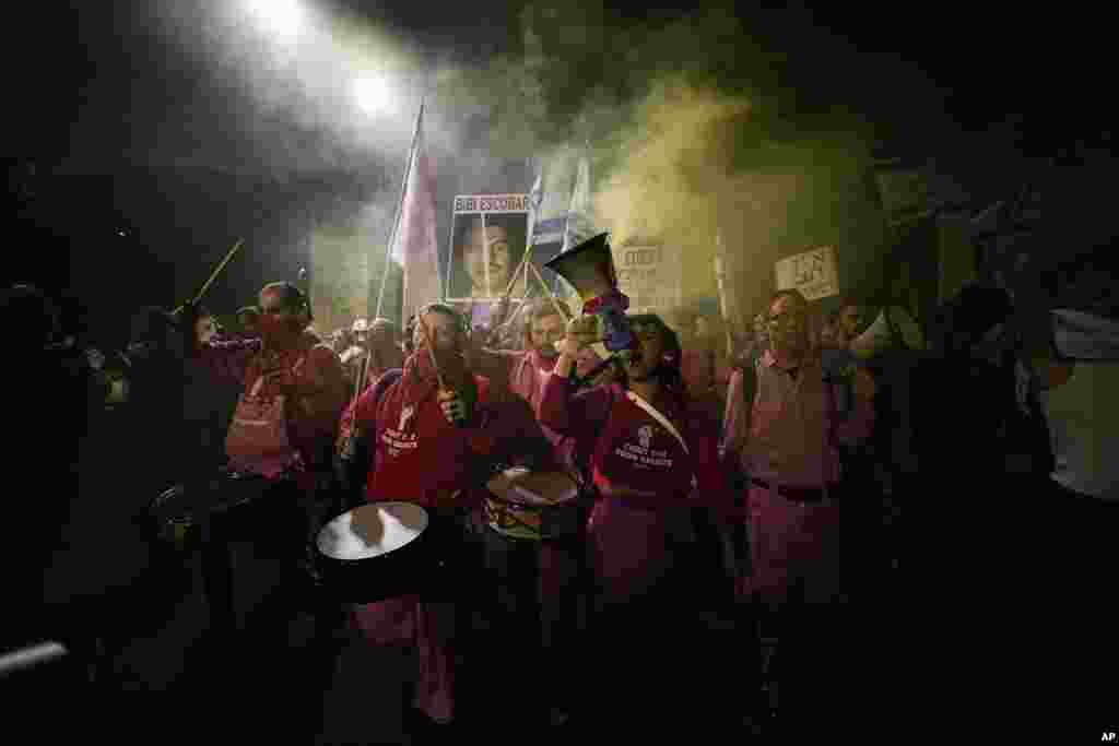Israelis protest against plans by Prime Minister Benjamin Netanyahu's new government to overhaul the judicial system, near the Knesset, Israel's parliament in Jerusalem.
