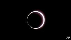 The moon passes between the Earth and the sun during a rare "ring of fire" eclipse of the sun, Oct. 14, 2023, in Bryce Canyon National Park, Utah.