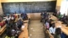 FILE - Children gather in a classroom at school in the village of Dori, Burkina Faso, Oct. 20, 2020.