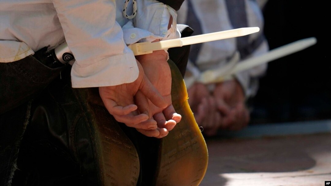 Protesters are cuffed after being detained on the campus of Emory University during a pro-Palestinian demonstration April 25, 2024, in Atlanta.