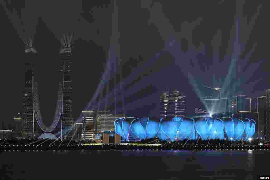 Hangzhou Olympic Sports Center Stadium, the opening ceremony venue for the 19th Asian Games Hangzhou 2022, is lit up during a light show ahead of the games in Hangzhou, Zhejiang province, China.