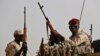 FILE - Sudanese soldiers from the Rapid Support Forces unit secure an area in the East Nile province, Sudan, June 22, 2019. Calls to end Sudan's current 14-month war have come and gone with little effect.