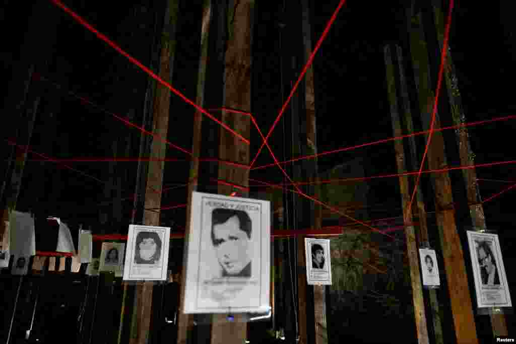 Signs featuring detained and missing people and reading 'Truth and Justice' are placed at Jose Domingo Canas Memorial House, a former detention, torture and forced disappearance quarters of the secret police of the Augusto Pinochet dictatorship, in Santiago, Chile, Aug. 16, 2023.