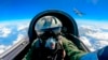 FILE - A Chinese fighter jet pilot from the People's Liberation Army (PLA) takes part in combat readiness patrol and military exercises around Taiwan, April 9, 2023, in this photo released by Xinhua News Agency.