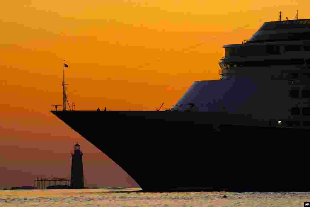 The Zaandam, Holland America Line's 781-foot cruise ship, passes by Ram Island Ledge Light at the mouth of Portland Harbor, off Cape Elizabeth, Maine.