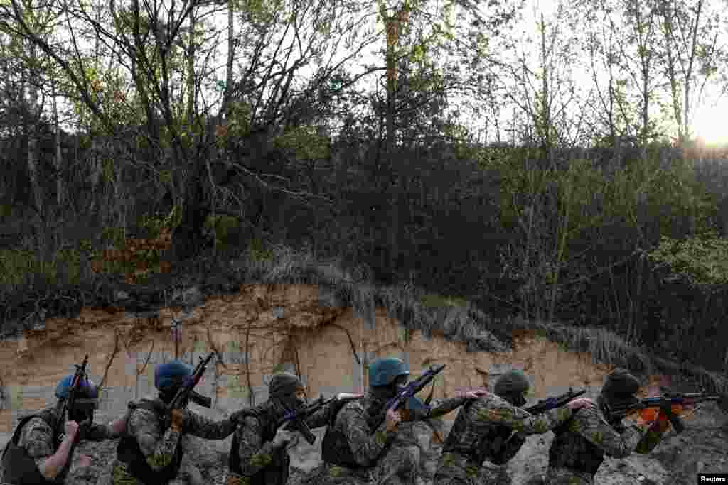 Members of the Siberian Battalion of the Ukraine's Armed Forces International Legion attend military exercises at an undisclosed location in Kyiv region, Ukraine.