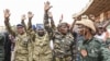 FILE - Nigerien military leaders wave to supporters at the General Seyni Kountche Stadium in Niamey, Niger, on Aug. 26, 2023. 