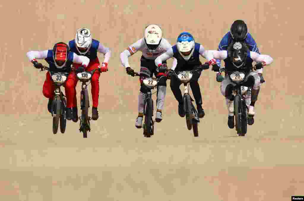 Riders compete during the BMX Racing men's elite final of the UCI World Championships in Glasgow, Scotland, Britain.