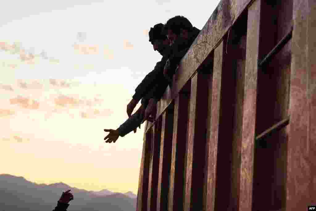 Refugees stand in the back of a truck after crossing the border near Kornidzor. More than 65,000 Armenians have fled Nagorno-Karabakh for Armenia, as the exodus continued from the breakaway enclave which Azerbaijan recaptured last week in a lighting offensive. 