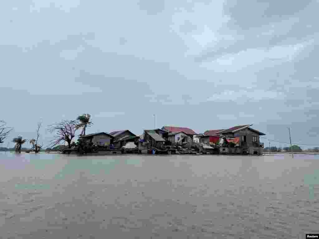 Houses are seen submerged in floodwaters after monsoon rains and a typhoon in Calumpit, Bulacan Province, Philippines.