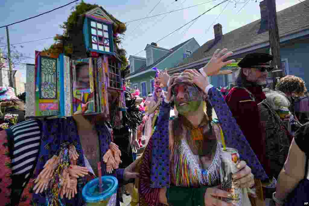Revelers participate in the La Socete de Saint Anne Parade on Mardi Gras Day in New Orleans, Louisiana.