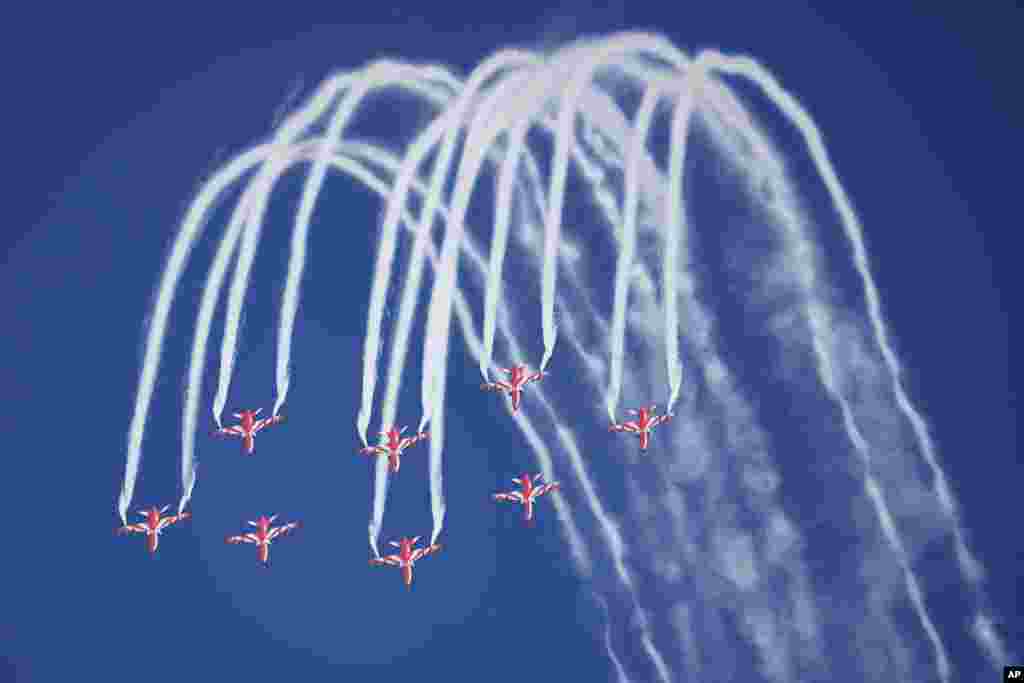 Indian Air Force's aerobatic team Suryakiran performs maneuvers on the first day of the Aero India 2023 at Yelahanka air base in Bengaluru.