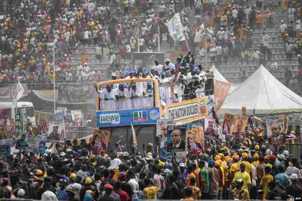 The bus of Presidential candidate, Bola Tinubu of the All Progressives Congress arrives at the Teslim Balogun Stadium during their final campaign rally in Lagos, Nigeria.