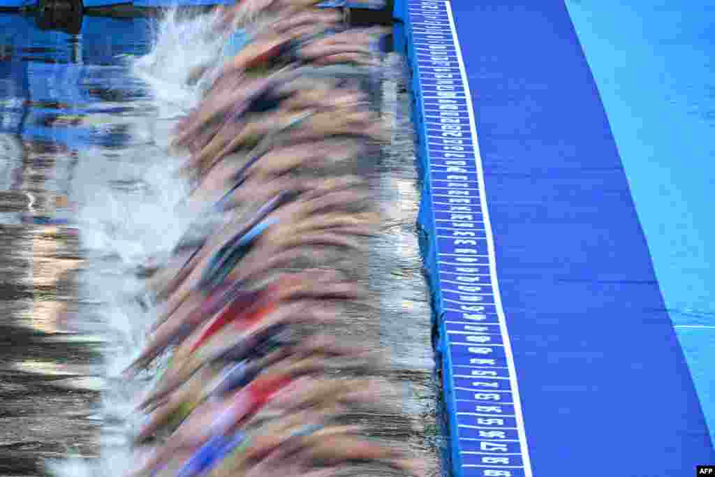 Triathlon athletes compete during a swimming event in the Seine River during a Test Event for the women's triathlon for the upcoming 2024 Olympic Games in Paris, France.
