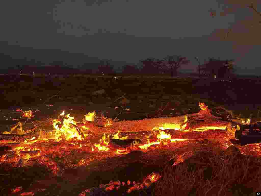 A wildfire burns in Kihei, Hawaii, Aug. 9, 2023. Thousands of residents raced to escape homes on Maui as blazes swept across the island, destroying parts of a centuries-old town in one of the deadliest U.S. wildfires in recent years. 