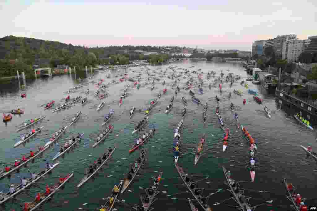 Rowers participate in the annual 'La Traversee de Paris en Aviron' rowing event in the River Seine in Paris, France. The event brings together more than 1,000 rowers and 230 boats.