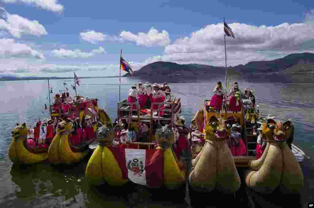 Aymara Indigenous women arrive in boats on Lake Titicaca from the Uros floating islands to attend a march marking International Women's Day in to Puno, Peru.