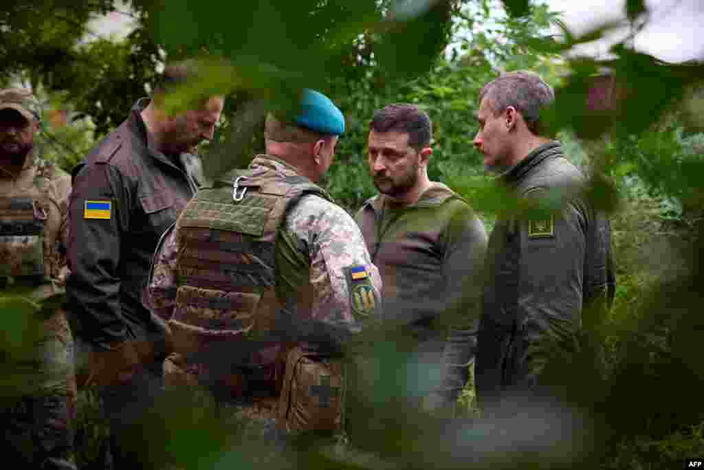 Ukrainian President Volodymyr Zelenskyy, 2nd right, talks with officers in the Vugledar-Maryinka defense zone, Donetsk region, on the occasion of the Marine Day, amid the Russian invasion of Ukraine. (Ukrainian Presidential press-service handout via AFP)