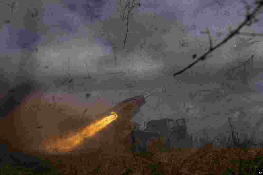 A Ukrainian MSLR BM-21 "Grad" of 95 Air Assault brigade fires towards Russian positions at the frontline near Kreminna.