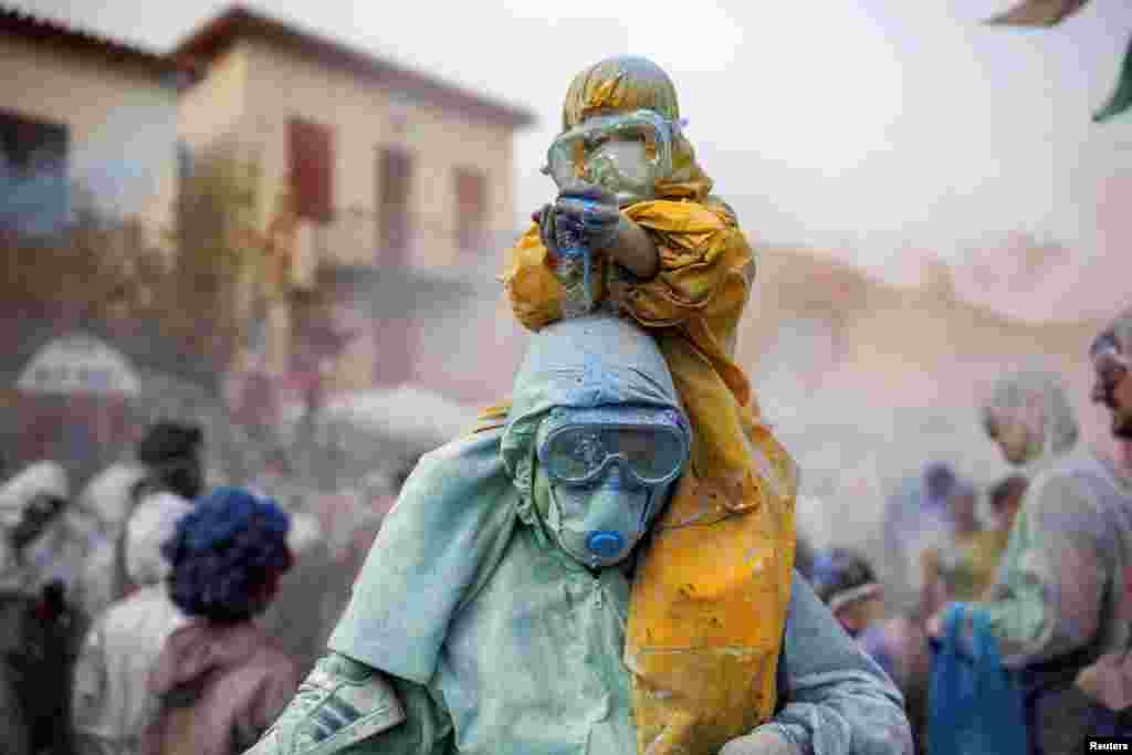 Revelers celebrate "Ash Monday," a traditional festivity marking the end of the carnival season and the start of the 40-day Lent period until the Orthodox Easter, in the port town of Galaxidi, Greece. 