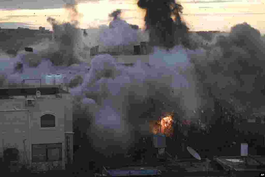 Israeli troops demolish the house of Palestinian Muhammed Kamel al-Jabari, who carried out a deadly shooting attack last year that killed one Israeli, in the West Bank city of Hebron.