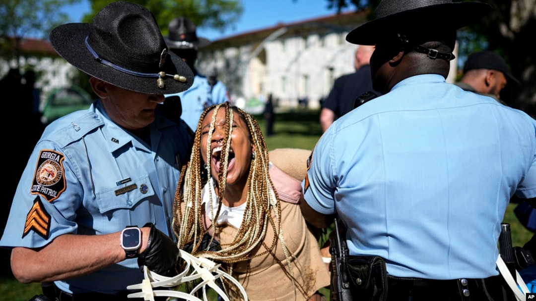 Georgia State Patrol officers detain a demonstrator on the campus of Emory University during a pro-Palestinian demonstration, April 25, 2024, in Atlanta.