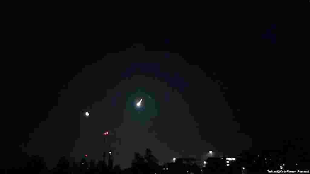 A view of a small asteroid passing through Earth's atmosphere in Brighton, Britain, Feb. 13, 2023 in this screen grab obtained from a social media video.