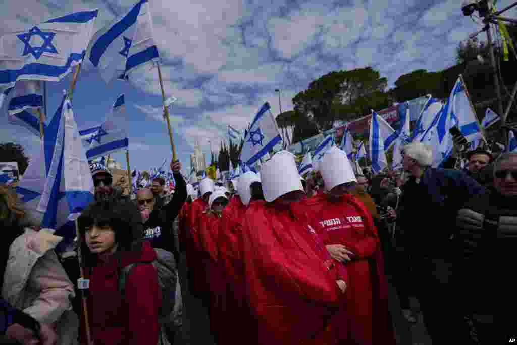 Israelis protest against plans by Prime Minister Benjamin Netanyahu's new government to overhaul the judicial system, outside the Knesset, Israel's parliament, in Jerusalem.