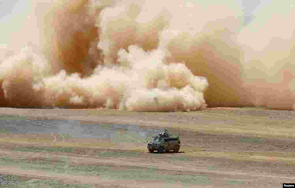 A military vehicle drives during the 'Eager Lion' joint military drills with the participation of the Jordanian Armed Forces, the U.S. and other partner countries, in Maan, Jordan.