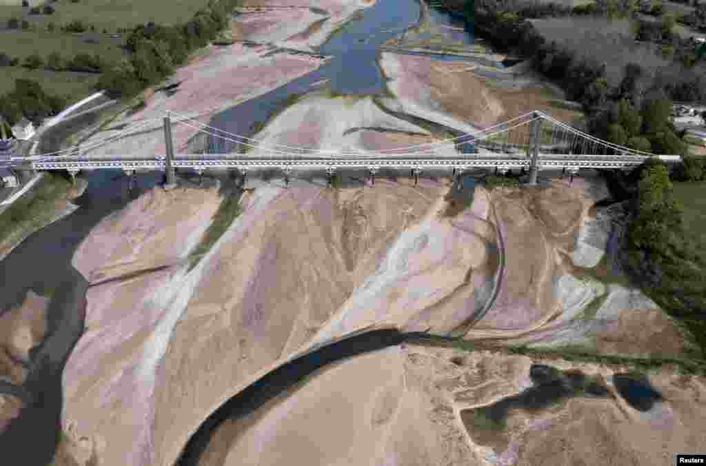 A view shows a bridge with sandbanks of a branch of the Loire River in Loireauxence, France.