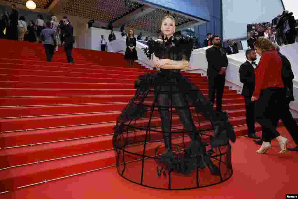 Polina Pushkareva poses on the red carpet during arrivals for the screening of the film "L'Amour ouf" (Beating Hearts) in competition at the 77th Cannes Film Festival in Cannes, France.