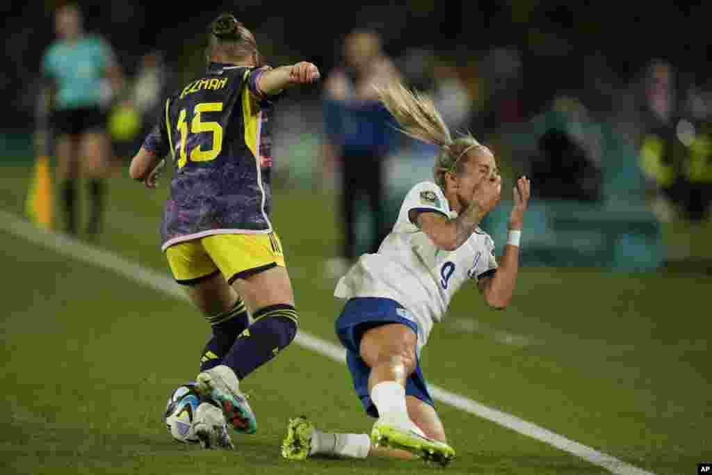 England's Rachel Daly is fouled by Colombia's Ana Guzman during the Women's World Cup quarterfinal soccer match between England and Colombia at Stadium Australia in Sydney, Australia, Aug. 12, 2023.