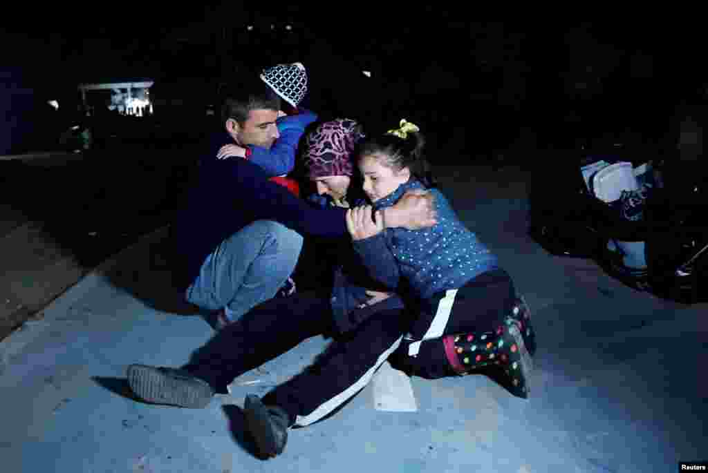 People react after an earthquake in Antakya in Hatay province, Turkey, Feb. 20, 2023.