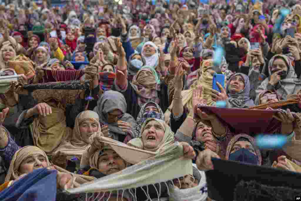 Kashmiri Muslim women pray as the head priest displays a relic at the Hazratbal shrine on the occasion of Mehraj-u-Alam, believed to mark the ascension of Prophet Muhammad to heaven, in Srinagar, Indian-controlled Kashmir.