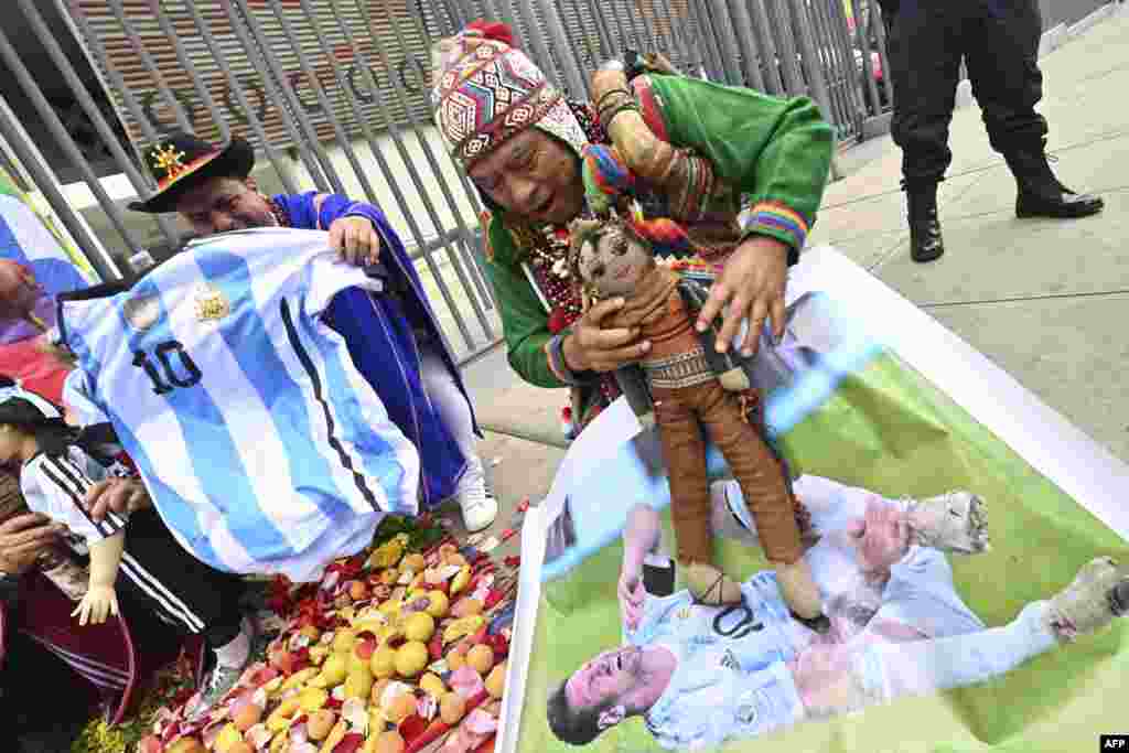 Peruvian shamans perform a ritual of predictions in front of the National Stadium in Lima, a day ahead of the 2026 FIFA World Cup South American Qualifiers football match between Peru and Argentina.