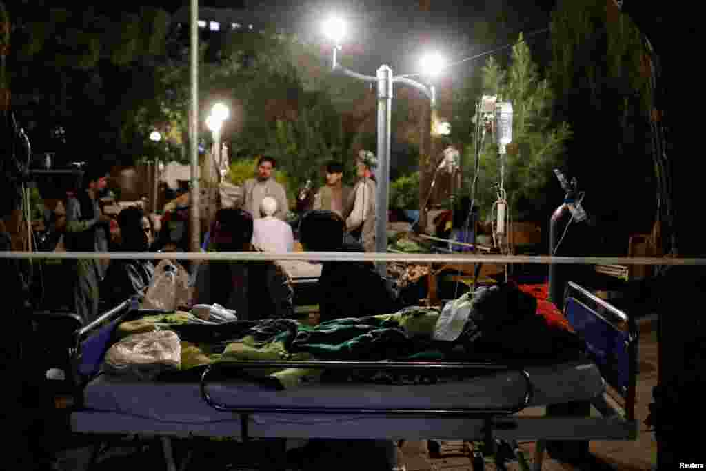 Afghans injured during the recent earthquake receive treatment at a hospital compound in Herat, Oct. 8, 2023.