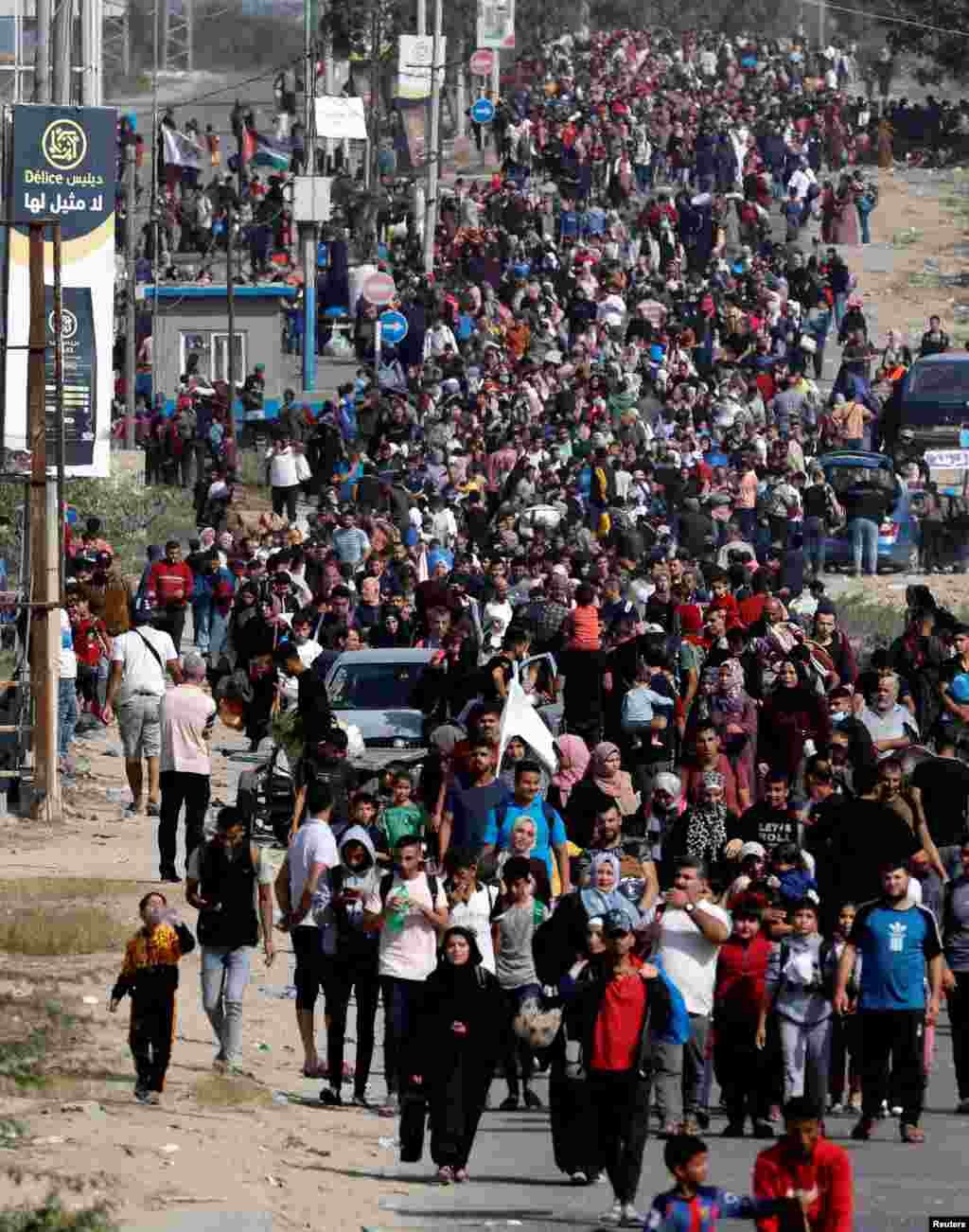 Palestinians fleeing north Gaza walk towards the south in the central Gaza Strip amid the ongoing conflict between Israel and Palestinian Islamist group Hamas.