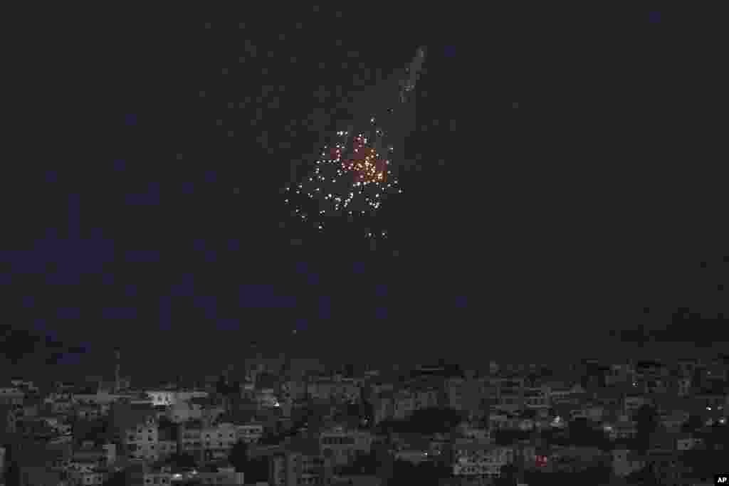A shell from Israeli artillery explodes over Bastra Farms in the disputed Shebaa Farms territory, south Lebanon. A Lebanese security official said six rockets were fired from southern Lebanon into northern Israel. 